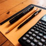image of calculator and pens